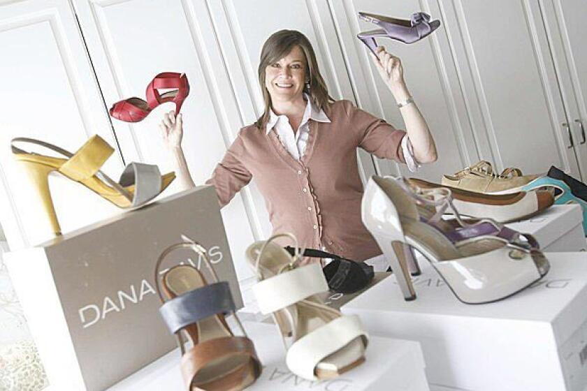 Dana Davis, shown here in her Brentwood home, with some of her high-fashion orthotic shoes. Sarah McLachlan, Anne Hathaway and Vivica Fox are among the celebrities who have worn Davis' creations.