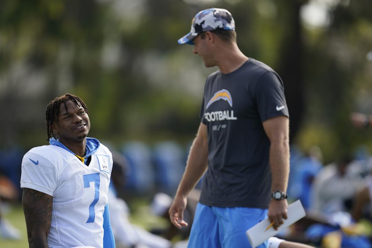 Coach Brandon Staley greets tight end Gerald Everett on the first day in pads for the Chargers at training camp.