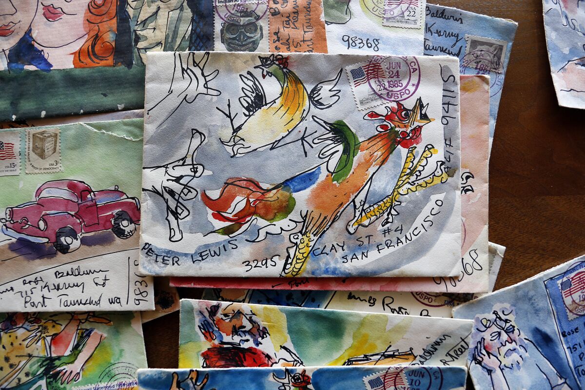 A few of the hundreds of cartoons crafted by artist Clayton Lewis on envelopes that accompanied letters he mailed to friends, family and his mother living in Washington.