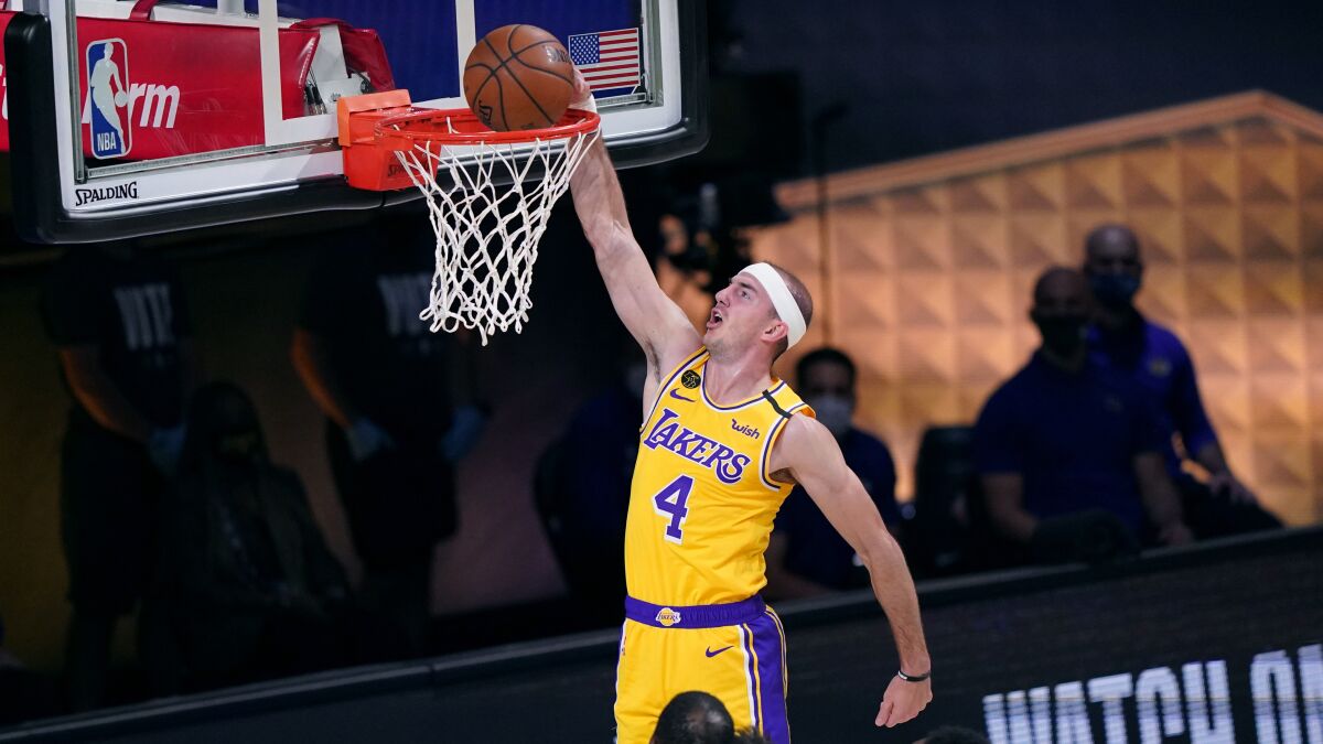 Lakers guard Alex Caruso scores on a breakaway dunk against the Heat during Game 1.