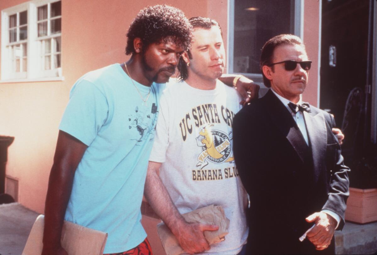 Samuel L. Jackson, left, John Travolta, Samuel L. Jackson and Harvey Keitel in a scene from "Pulp Fiction" (1994).