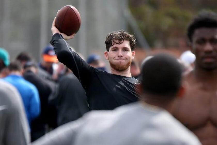 Occidental College quarterback Bryan Scott participates in USC's pro day workout on Wednesday.
