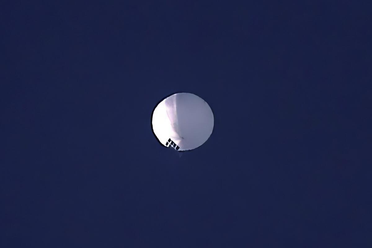 A high-altitude balloon floats in the sky