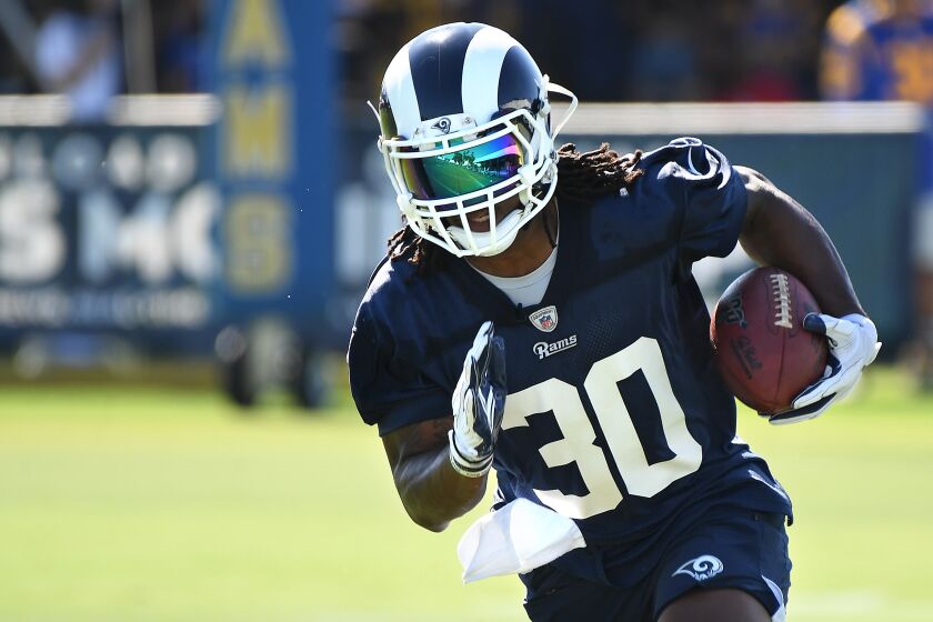 IRVINE, CALIFORNIA JULY 27, 2019-Rams running back Todd Gurley carries the ball during the opening of training camp at U.C. Irvine Saturday. (Wally Skalij/Los Angeles Times)