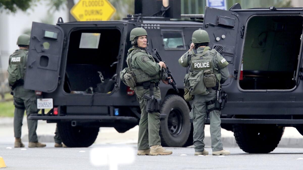 SWAT officers respond to the scene of the search for a burglary suspect police believed might have been armed.