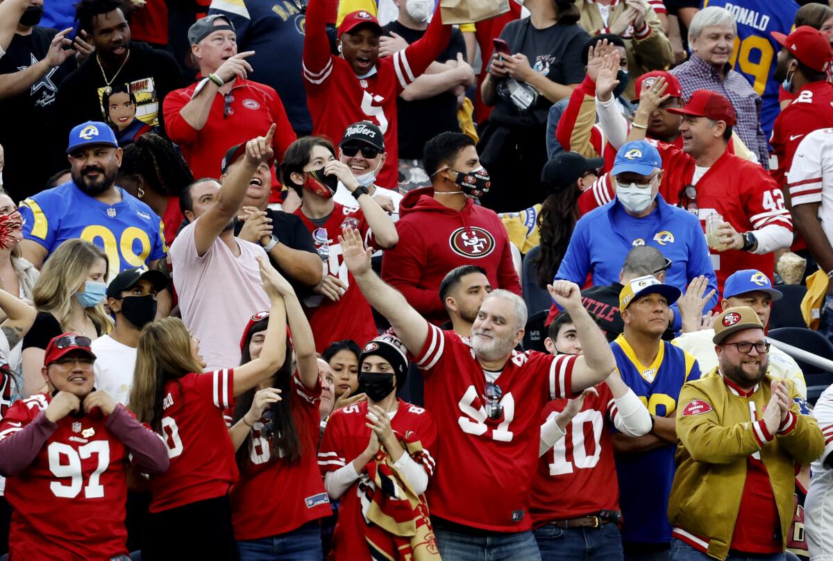 San Francisco fans celebrate during the 49ers’ upset victory over the Rams in the regular-season finale. 