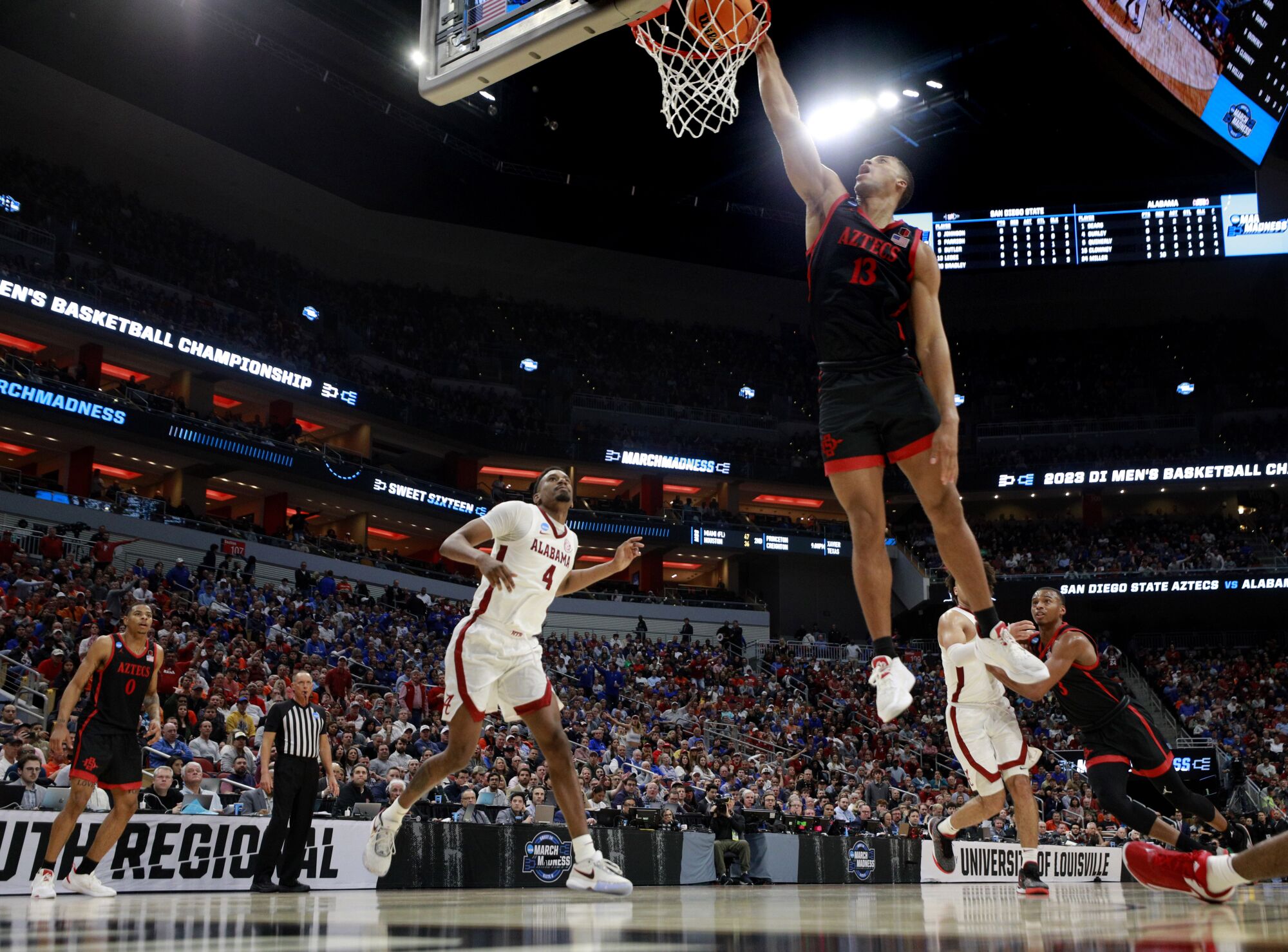San Diego State's Jaedon LeDee slams the ball against Alabama in a Sweet 16 game in the NCAA Tournament.