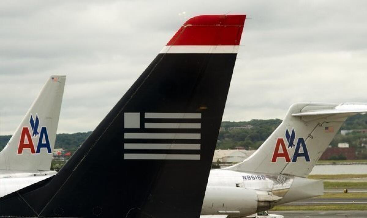 US Airways and American Airlines jets on the tarmac at Ronald Reagan Washington National Airport in Arlington, Va.