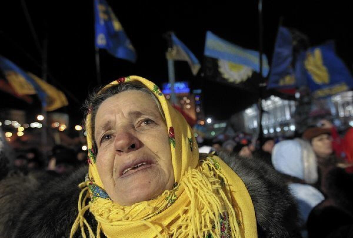 A demonstrator who favors a Ukrainian alliance with the European Union listens to a speaker in Independence Square in Kiev.
