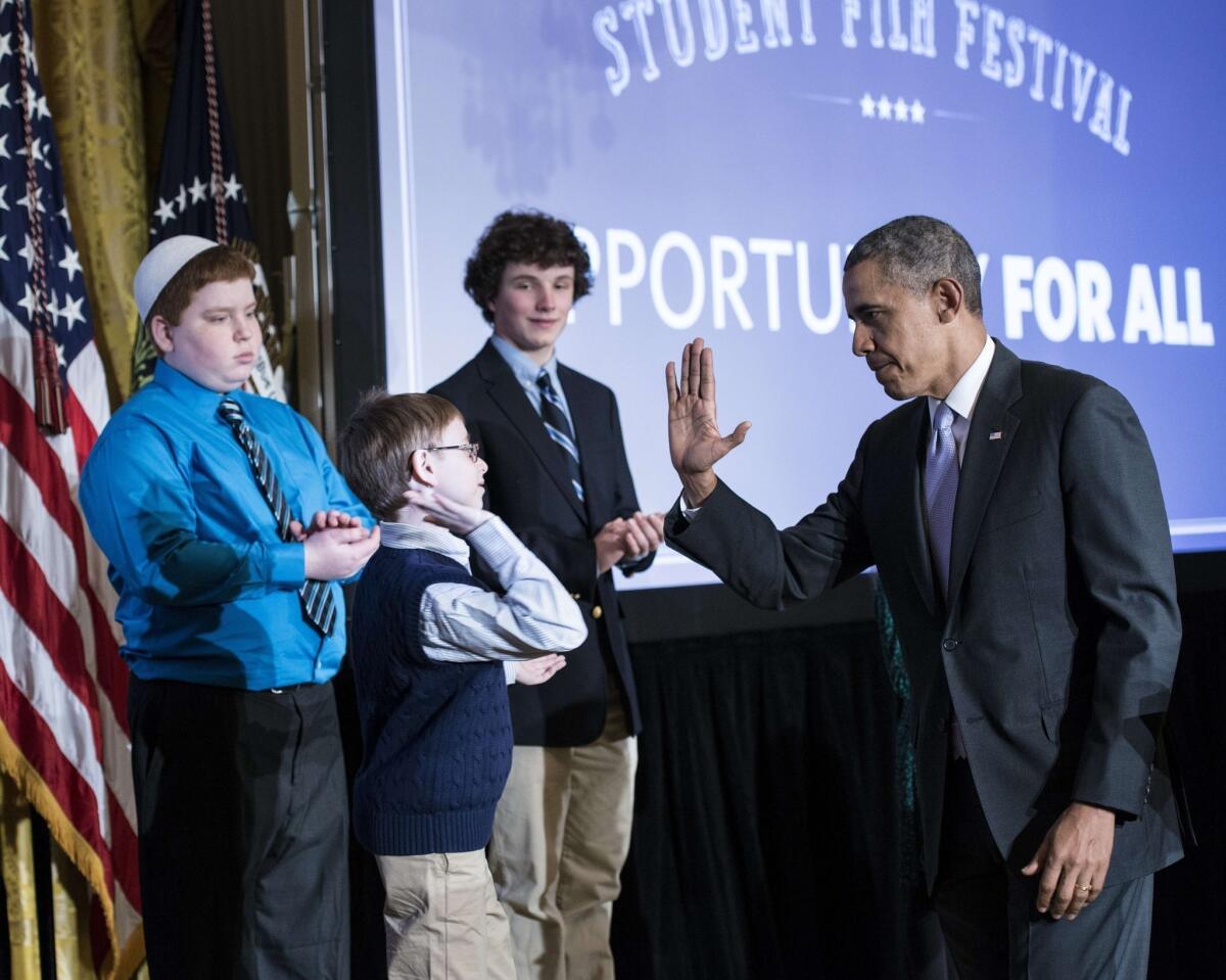 President Obama greets a student at a White House event where he announced additional contributions to his ConnectEd initiative to upgrade technology in schools.