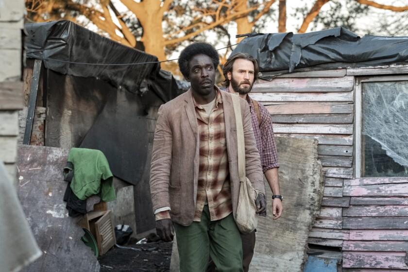 Michael Kenneth Williams, left, and Chris Evans in "Red Sea Diving Resort."
