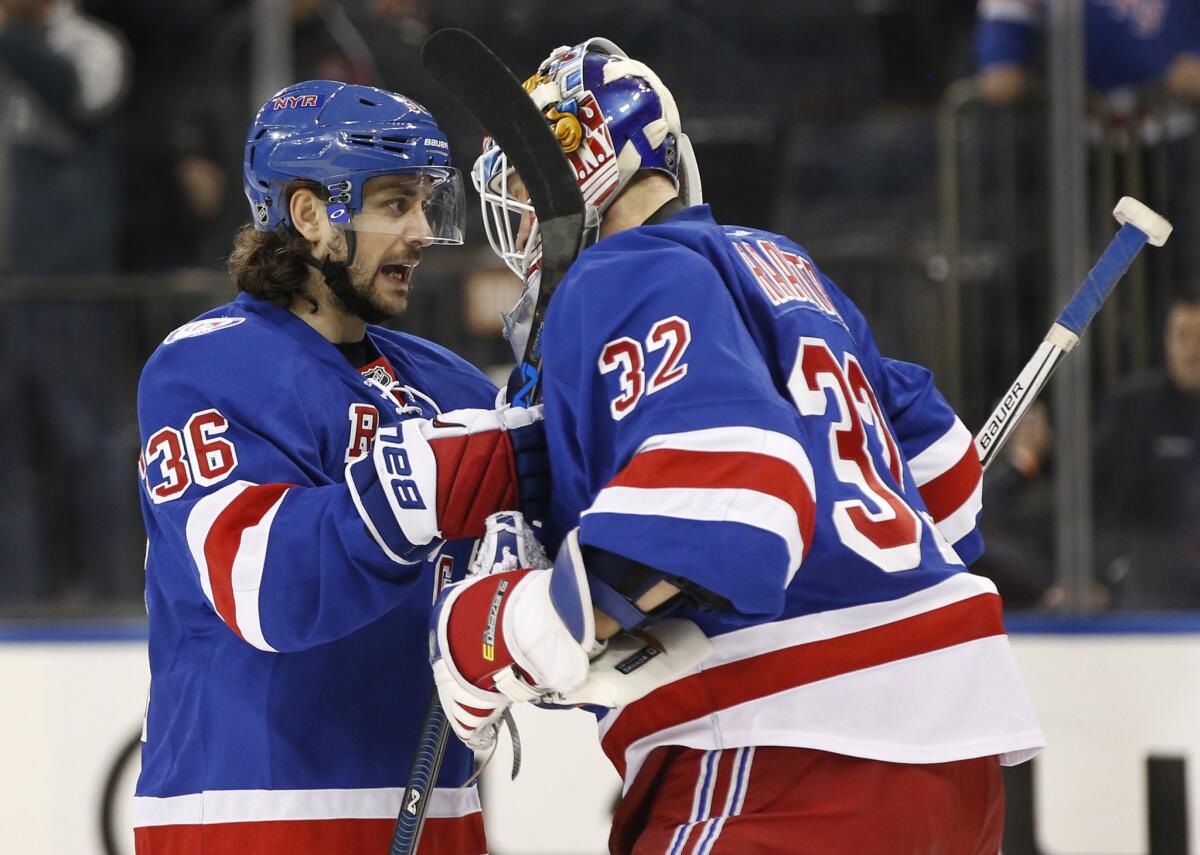 New York Rangers right wing Mats Zuccarello congratulates goalie Antti Raanta, who Sunday earned his second shutout in a row.