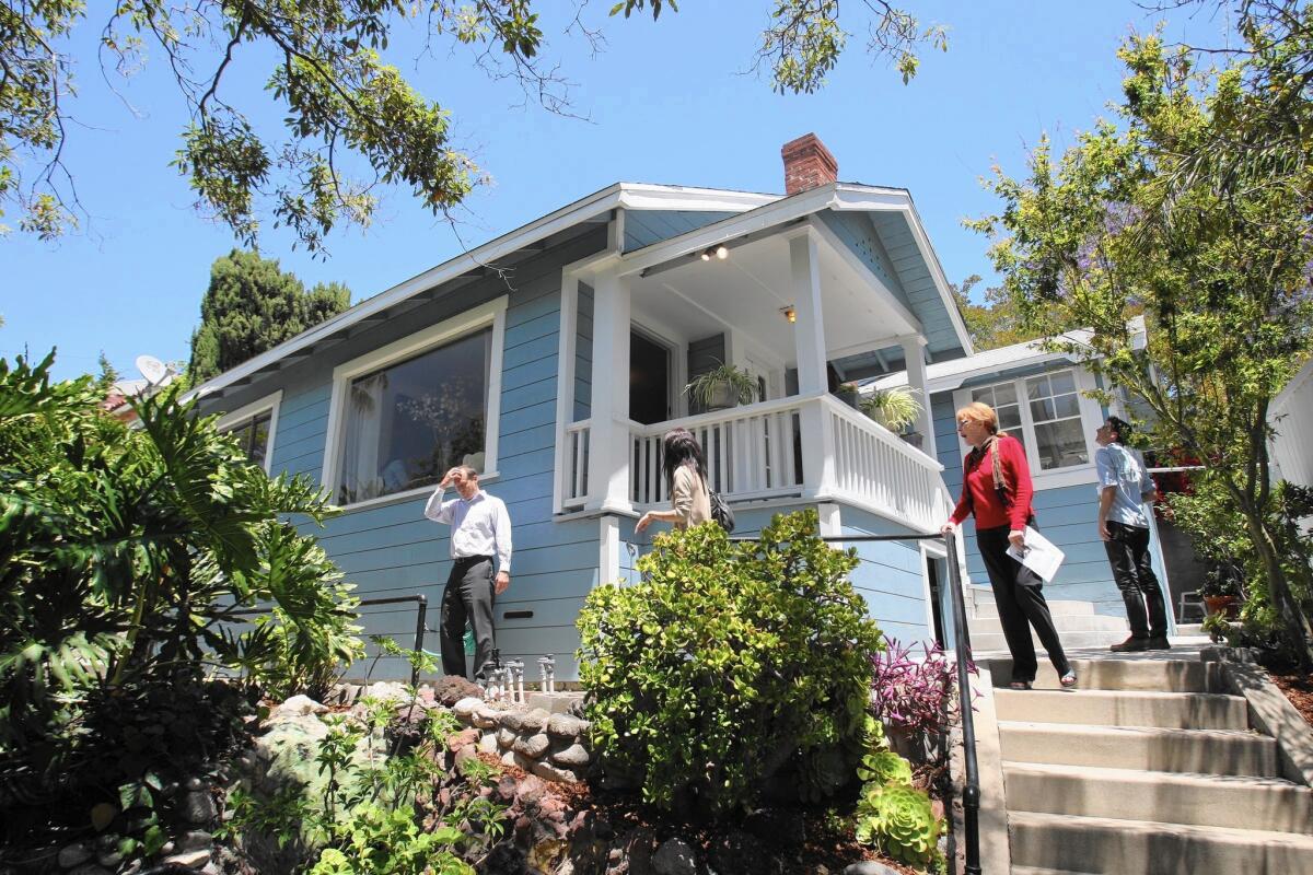 Real estate-related jobs have risen significantly in California as demand for commercial buildings and apartments has boomed. Above, an open house in Highland Park draws a steady stream of visitors in 2012.