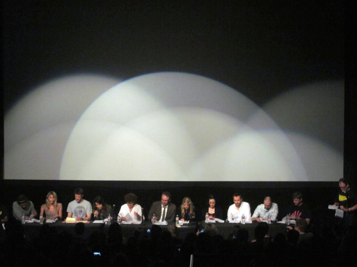 The cast and writers of the "The Middleman" reunite for a reading of "The Pan-Universal Parental Reconciliation," eventually to become a graphic novel. "Middleman" creator Javier Grillo-Marxuach is standing at right.