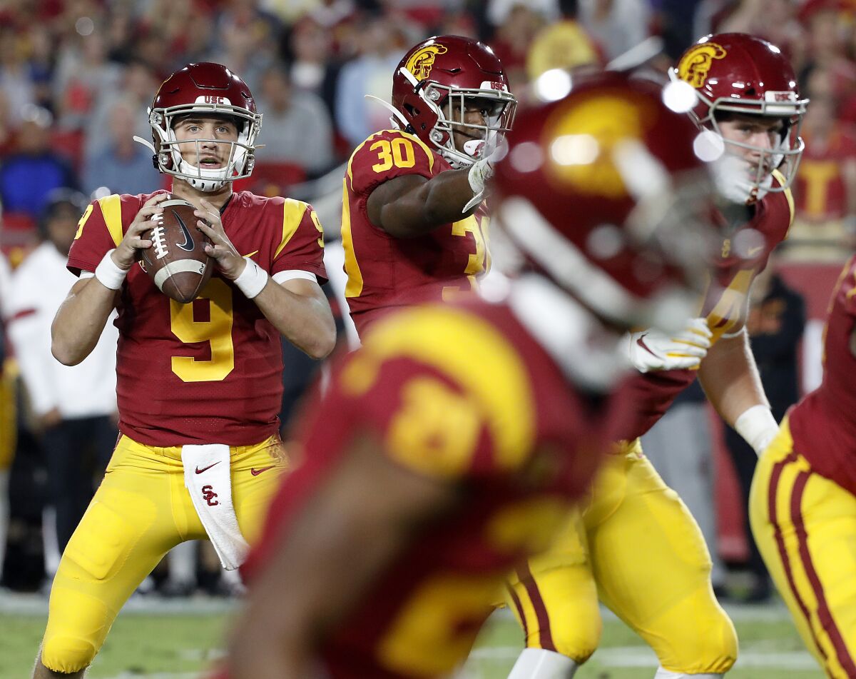 USC quarterback Kedon Slovis looks for an open man downfield against Arizona on Saturday night.