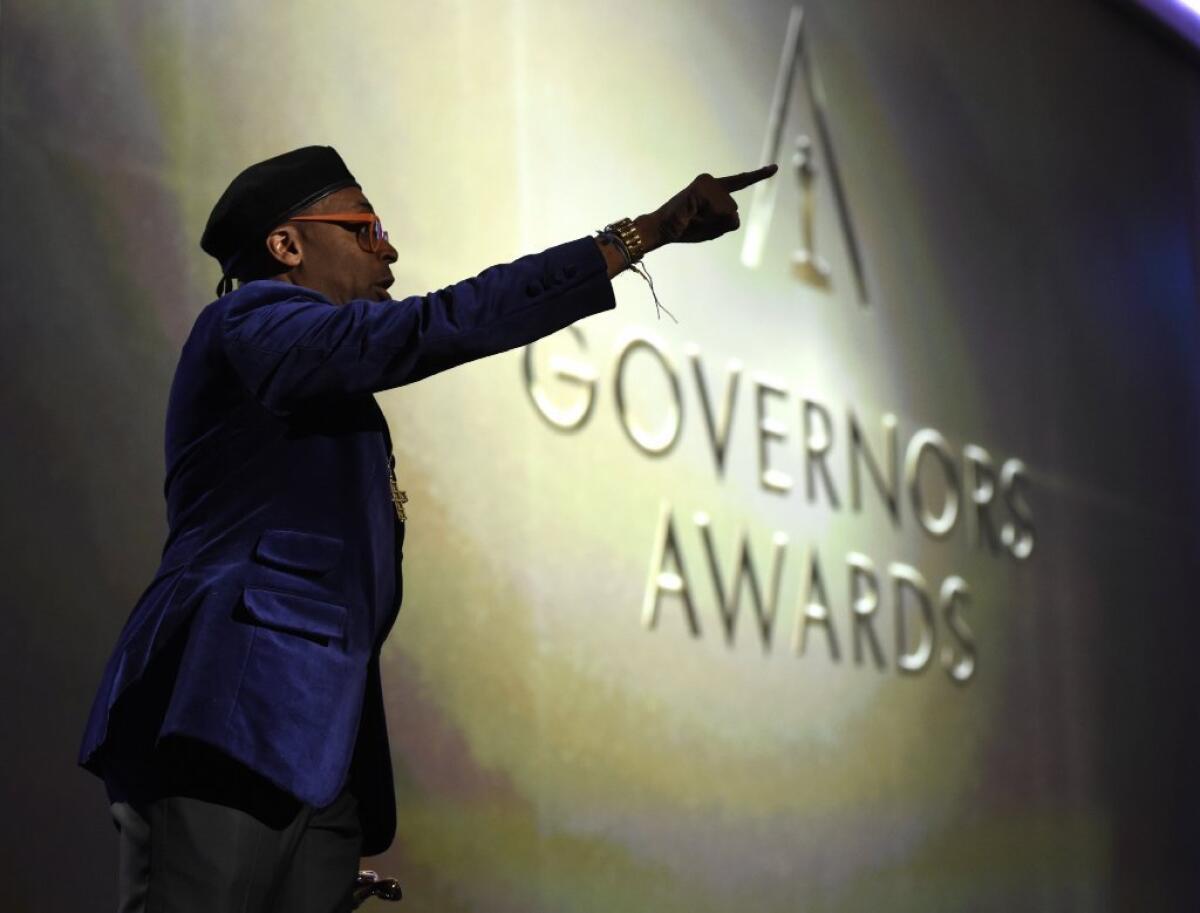 Spike Lee, honorary Oscar recipient, gestures onstage at the Governors Awards.