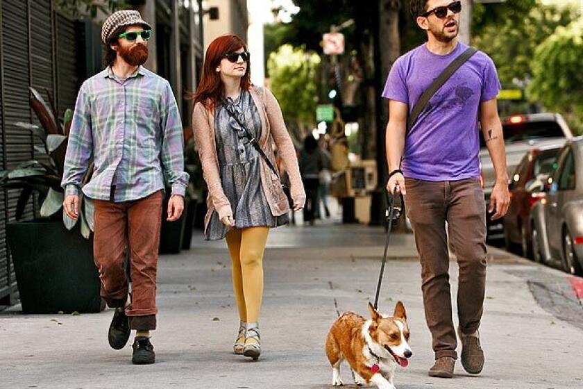 Joe Rubacka, left, his sister, Samantha Kuntz, and her husband, Michael Kuntz, walk along Spring Street with the Kuntzes' dog, Georgie. Just a few years ago, the proliferation of dogs was heralded as proof that a certain Westside hipness had arrived in the citys central core. See full story