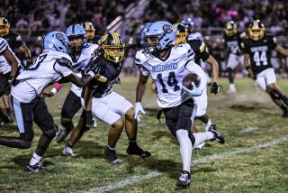 Carson starts out as No. 1 in the City Section. Jordin Daniel is carrying the football.