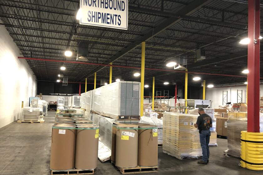 Boxes stack up at TECMA Transportation Services in Santa Teresa, New Mexico.