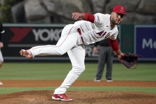 Los Angeles Angels' Carlos Estevez throws to the plate during the ninth inning of a baseball game against the Chicago White Sox Tuesday, June 27, 2023, in Anaheim, Calif. (AP Photo/Mark J. Terrill)