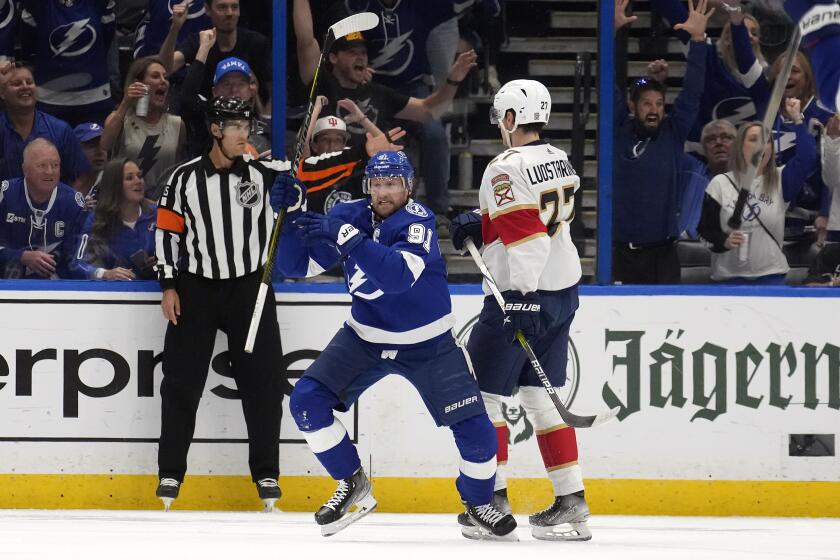 Tampa Bay Lightning center Steven Stamkos (91) celebrates his goal in front of Florida Panthers center Eetu Luostarinen (27) during the first period in Game 4 of an NHL hockey Stanley Cup first-round playoff series, Saturday, April 27, 2024, in Tampa, Fla. (AP Photo/Chris O'Meara)