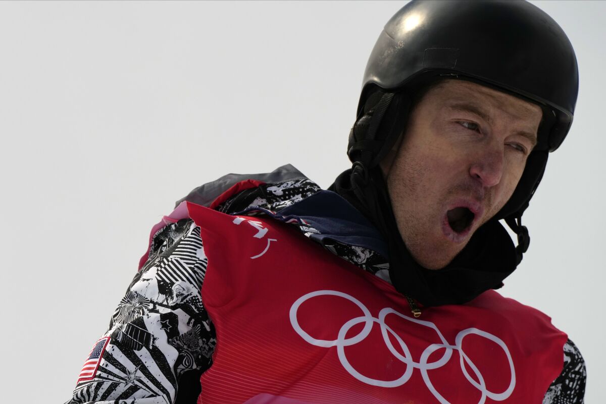 Shaun White reacts during the men's halfpipe qualification round.