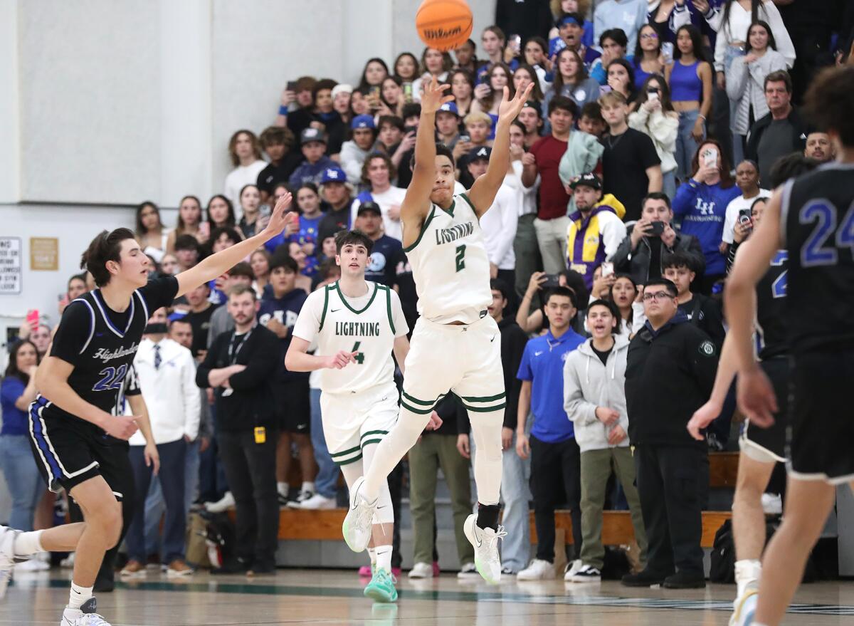 Sage Hill's Sergio Maggette (2) shoots a half-court shot at the fourth-quarter buzzer on Tuesday.