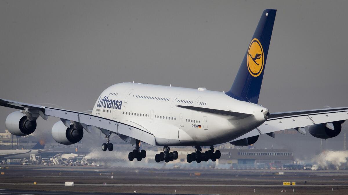 An Airbus A380 jet lands at the airport on Thursday in Frankfurt, Germany. The European plane manufacturer Airbus said Thursday it will stop making its super-jumbo A380 in 2021 for lack of customers.