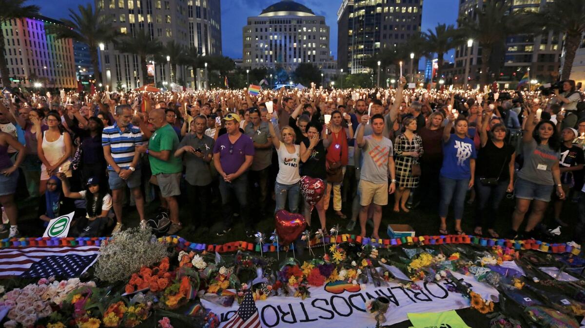 Thousands gather for a memorial service in downtown Orlando to honor those killed and wounded in the Pulse nightclub attack.