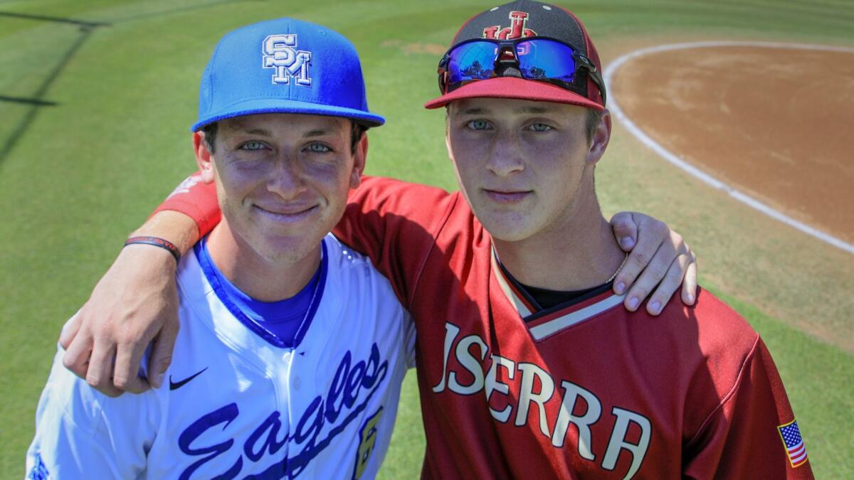 Brothers Alex, left, and Cody Schrier pose for a picture before playing against each other Tuesday.