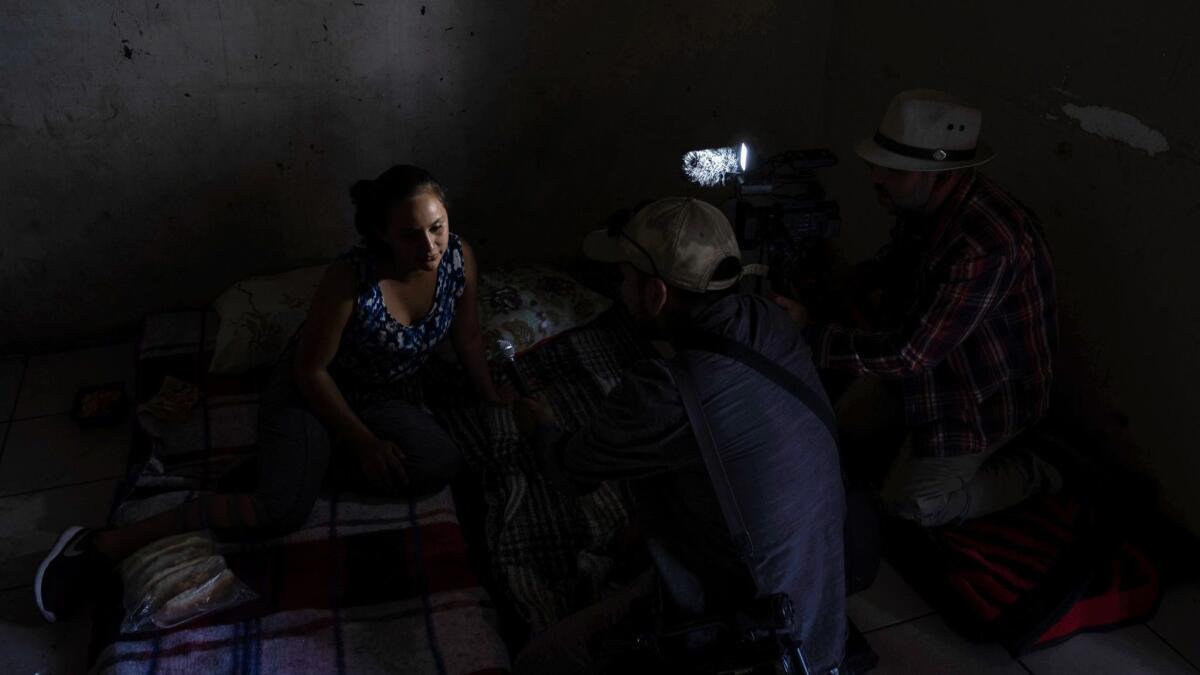 Reina Carolina Garcia waits at the Hotel Migrante shelter in Mexicali, Mexico.