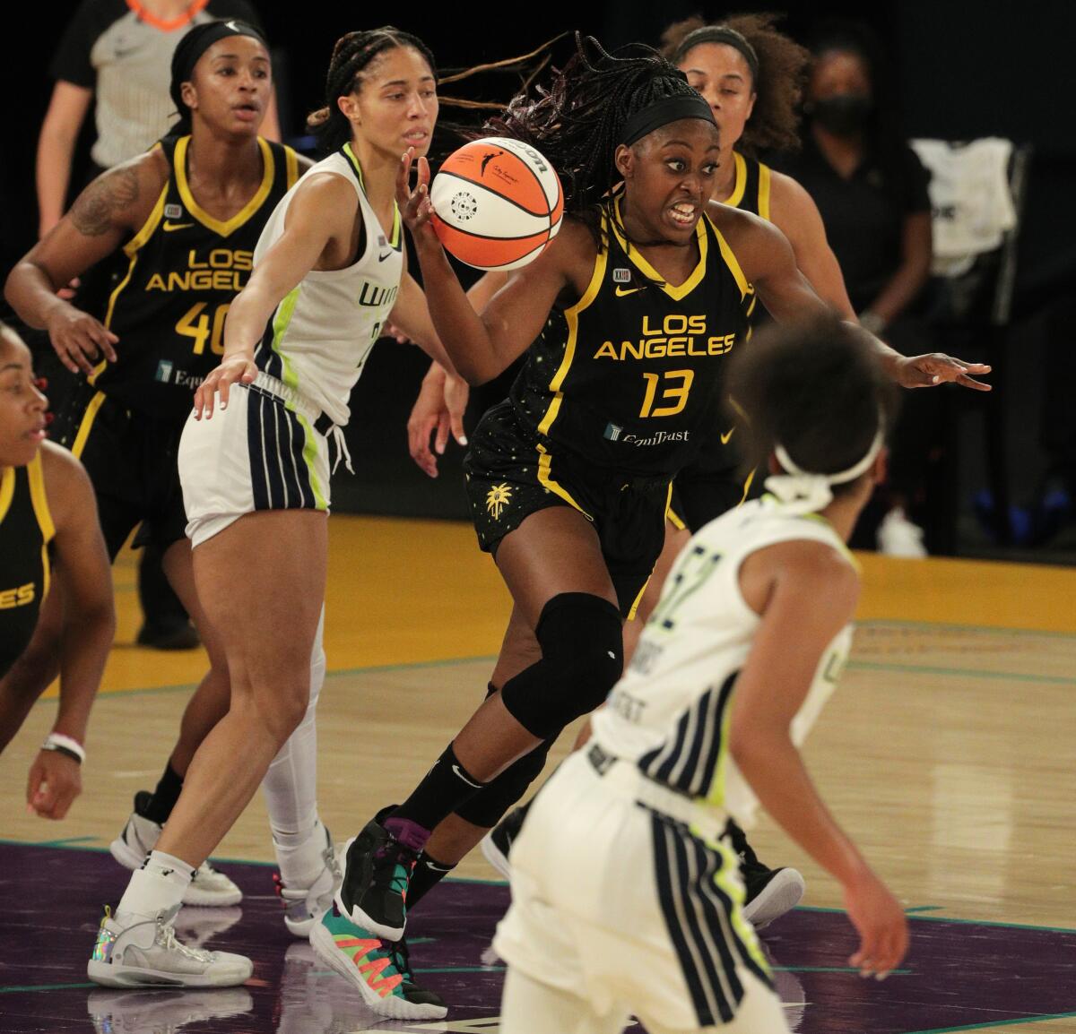 The Sparks' Chiney Ogwumike starts a fast break after grabbing a rebound May 14, 2021.