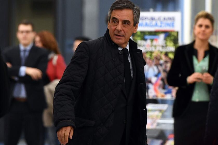 French presidential candidate Francois Fillon arrives at the headquarters of his Republican Party in Paris on Monday.