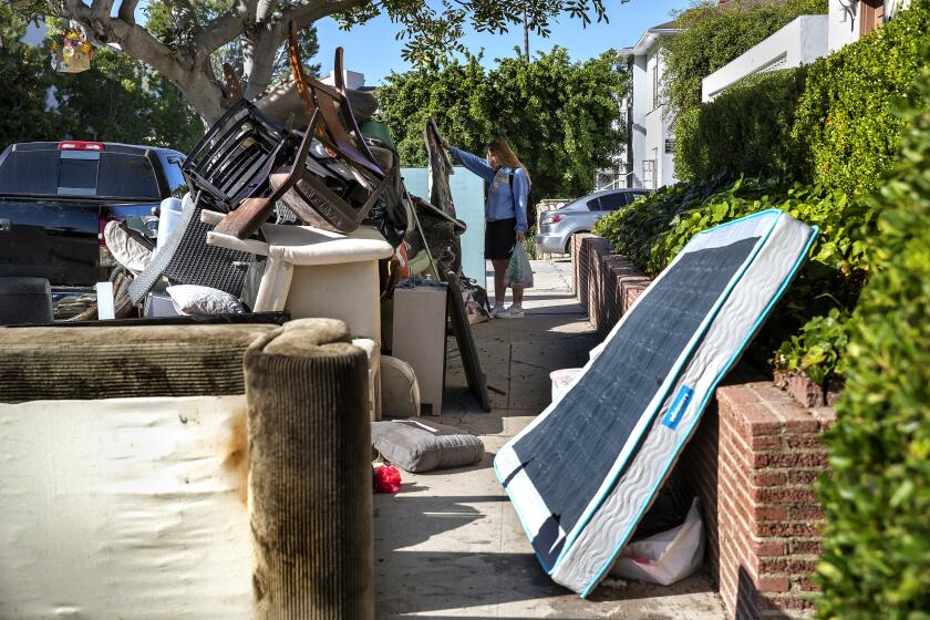 LOS ANGELES, CA-AUGUST 30, 2023:Discarded furniture from UCLA students who have just moved out is piled up outside a private apartment building on Roebling Ave. near the UCLA campus. (Mel Melcon / Los Angeles Times)