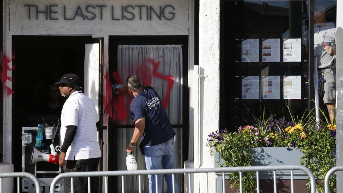 A production crew for the Starz show "Vida" cleans a shooting location along East 1st Sreet in Boyle Heights.