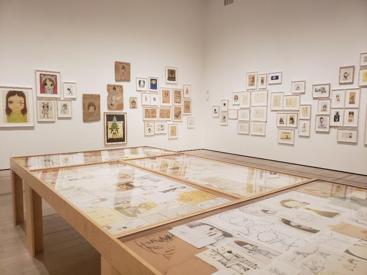 Walls and cases hold more than 700 drawings by Yoshitomo Nara.