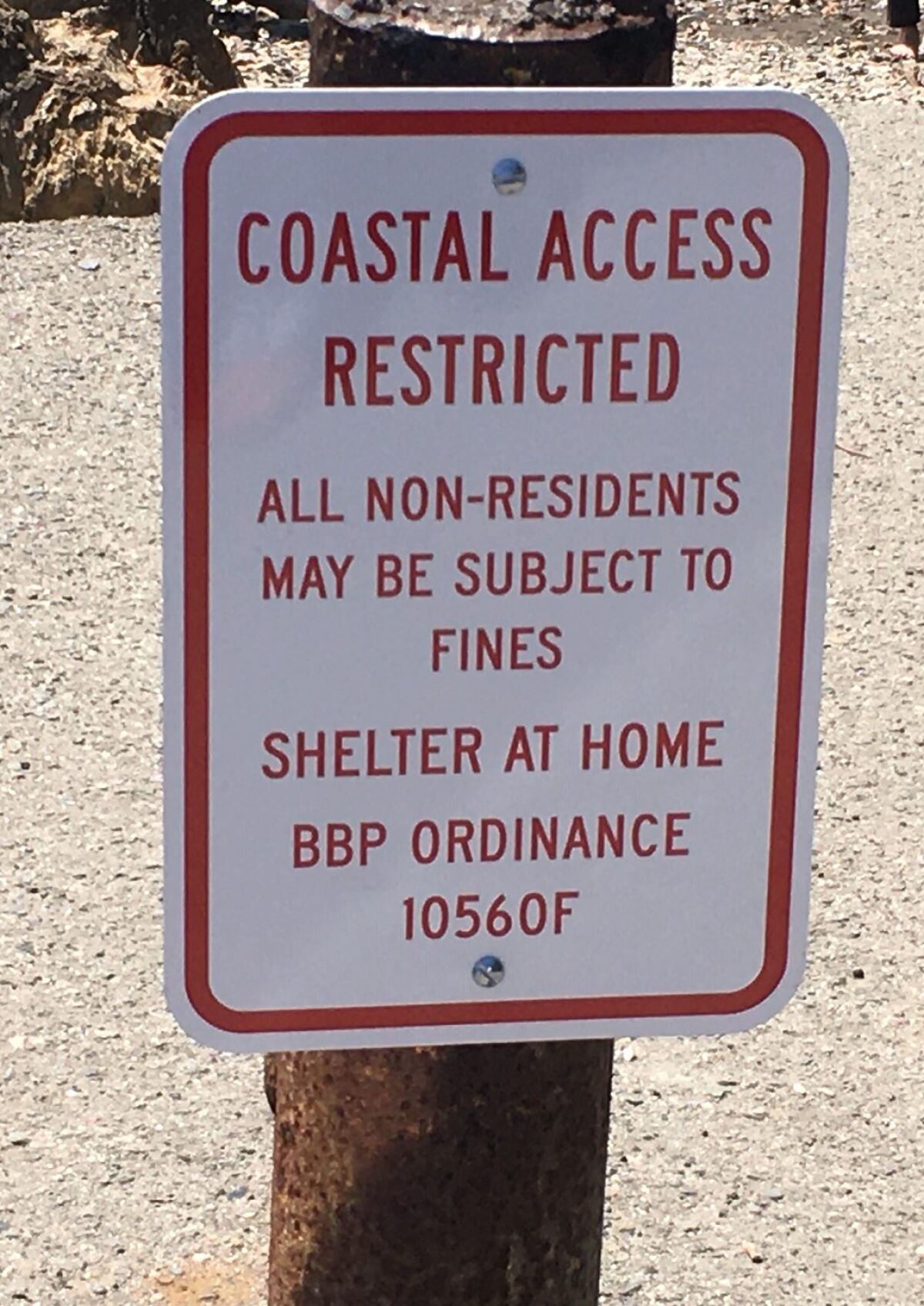 A sign warns outsiders to stay away in Bolinas, Calif.