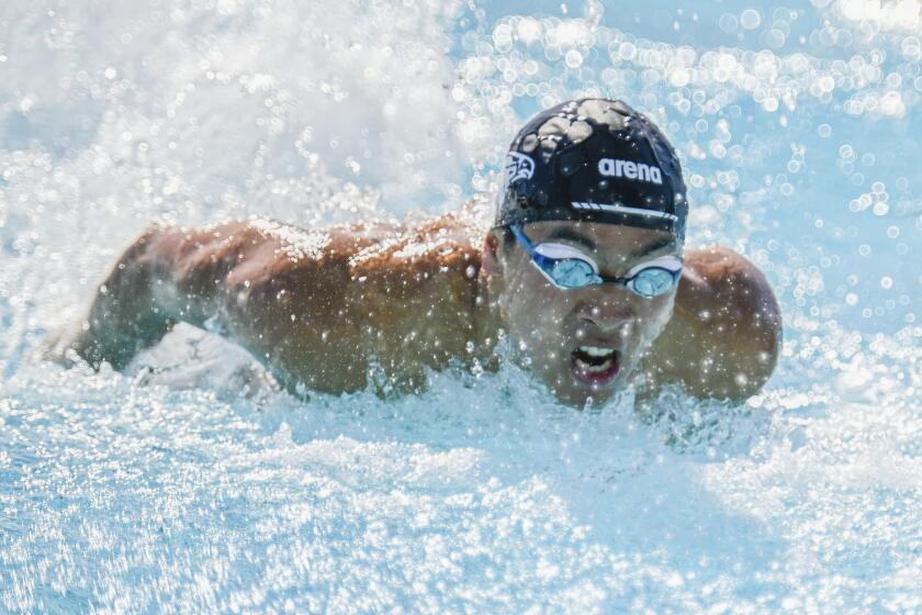 Logan Noguchi of Torrey Pines High School swims in the 100 yard butterfly event at the CIF-San Diego Division I championship held at Granite Hills High School May, 6, 2023 in El Cajon, Calif. (Photo by Denis Poroy)