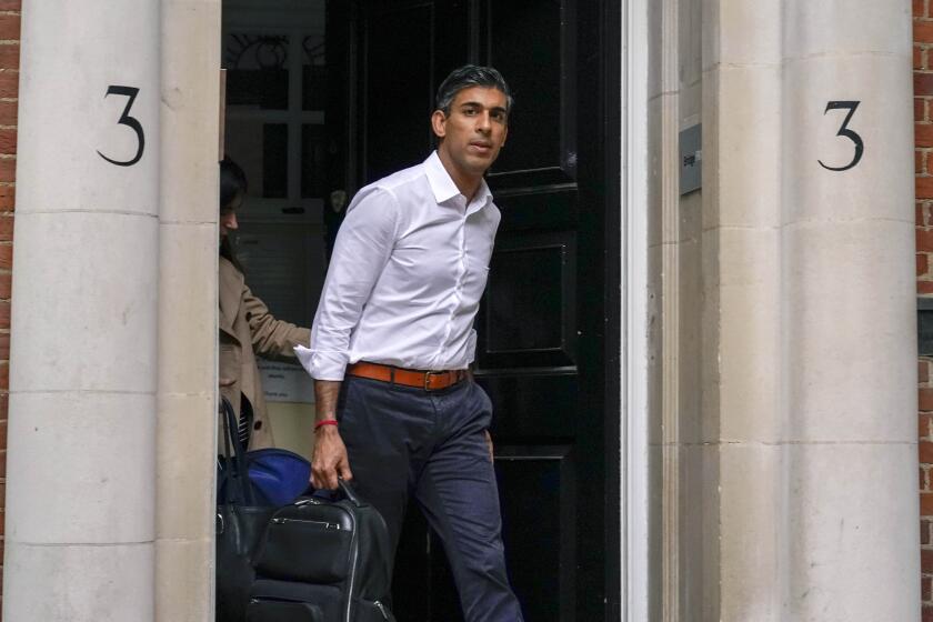 Conservative Party leadership candidate Rishi Sunak leaves his campaign office, in London, Sunday, Oct. 23, 2022. Former British Treasury chief Rishi Sunak is frontrunner in the Conservative Party’s race to replace Liz Truss as prime minister. He has garnered support from over 100 Tory lawmakers to forge ahead of his two main rivals: ousted former Prime Minister Boris Johnson and ex-Cabinet minister Penny Mordaunt. But widespread uncertainty remained after British media reported that Sunak held late-night talks with Johnson on Saturday. (AP Photo/Alberto Pezzali)
