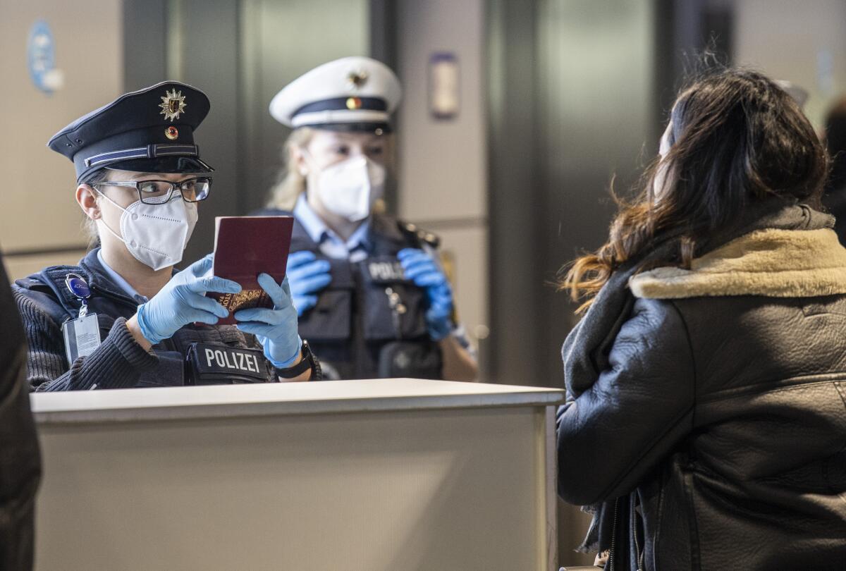 German Federal Police process passengers arriving in Frankfurt from Prague, the Czech capital.