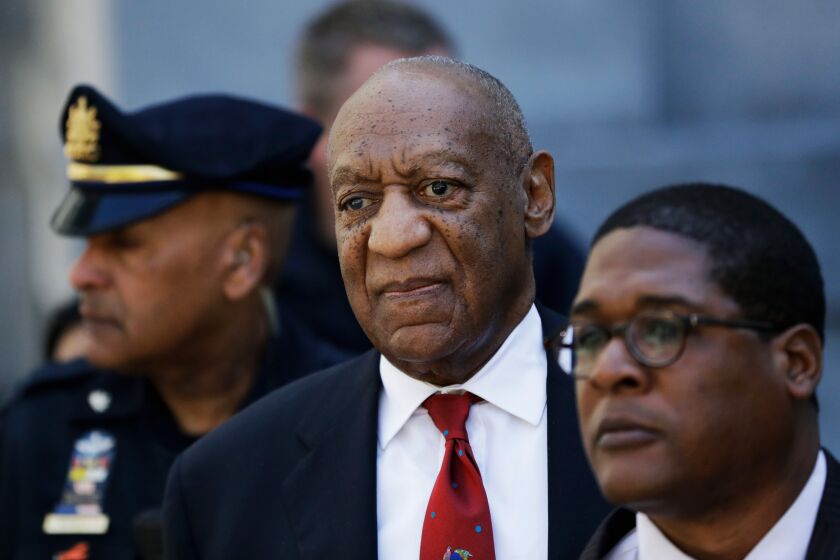 FILE - In this April 26, 2018 file photo, Bill Cosby, center, leaves the the Montgomery County Courthouse in Norristown, Pa., after being convicted of drugging and molesting a woman. The actor has spent more than two years in prison since he was convicted of sexual assault in the first celebrity trial of the #MeToo era. Now the Pennsylvania Supreme Court is set to hear his appeal of the conviction on Tuesday, Dec. 1, 2020. The arguments will focus on the trial judge's decision to let five other accusers testify for the prosecution. (AP Photo/Matt Slocum, File)