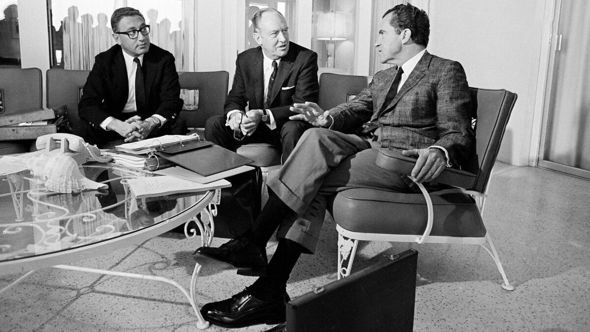President Richard Nixon meets with Henry Kissinger and Secretary of State William Rogers at his Key Biscayne, Fla., home in 1969.