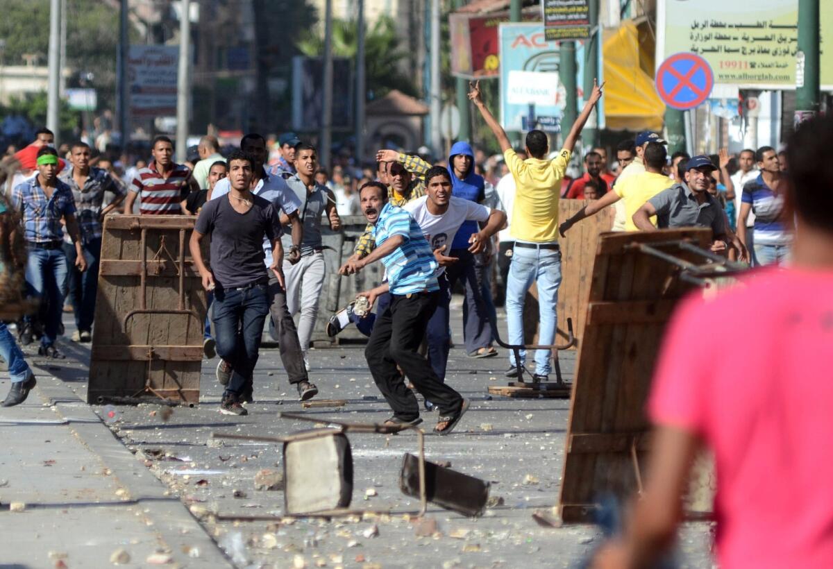 Supporters of Egypt's ousted president, Mohamed Morsi, clash with opponents in Alexandria.