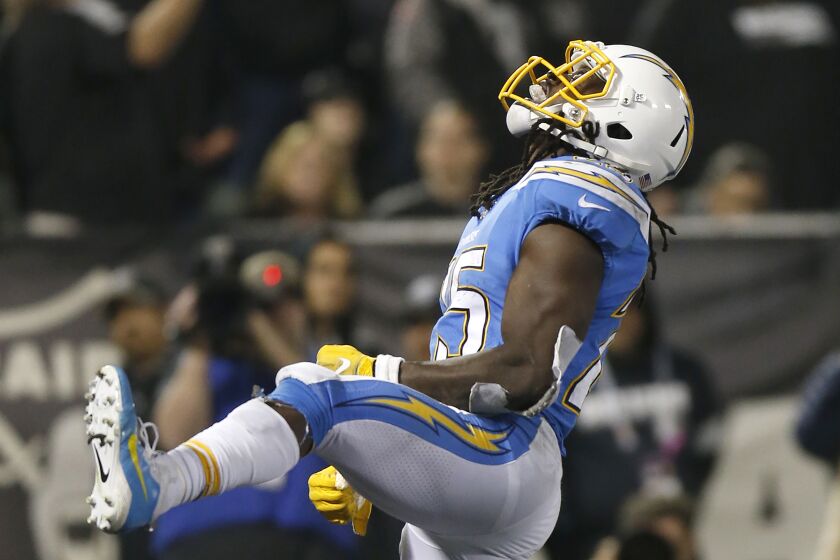 Los Angeles Chargers running back Melvin Gordon celebrates after scoring against the Oakland Raiders during the first half of an NFL football game in Oakland, Calif., Thursday, Nov. 7, 2019. (AP Photo/D. Ross Cameron)
