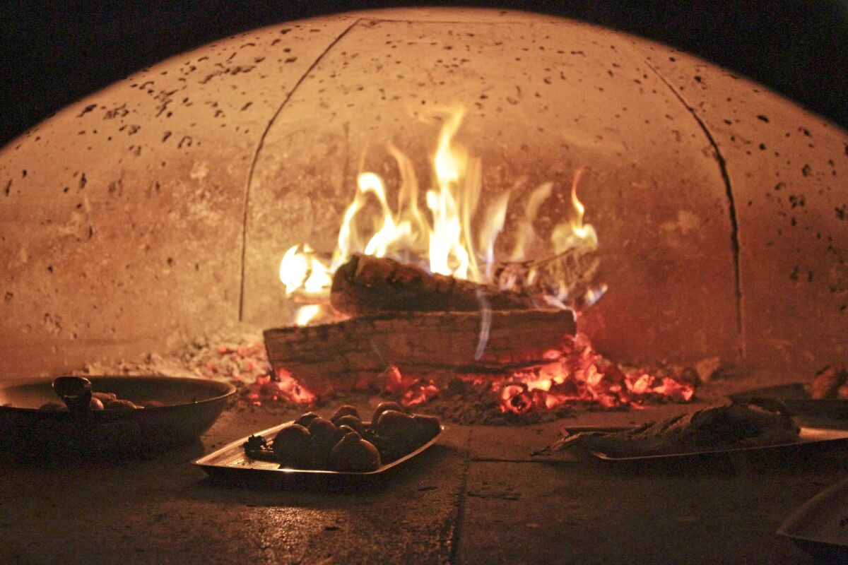 The wood oven at Tar & Roses restaurant. The restaurant is set to open after a long hiatus, after a fire closed it down last summer.