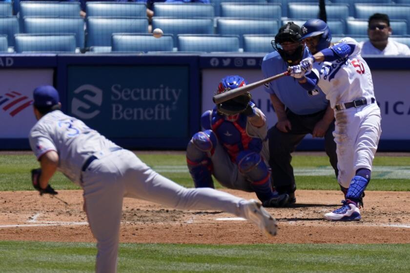 Dodgers right fielder Mookie Betts hits a solo home run off Texas Rangers starting pitcher Dane Dunning.