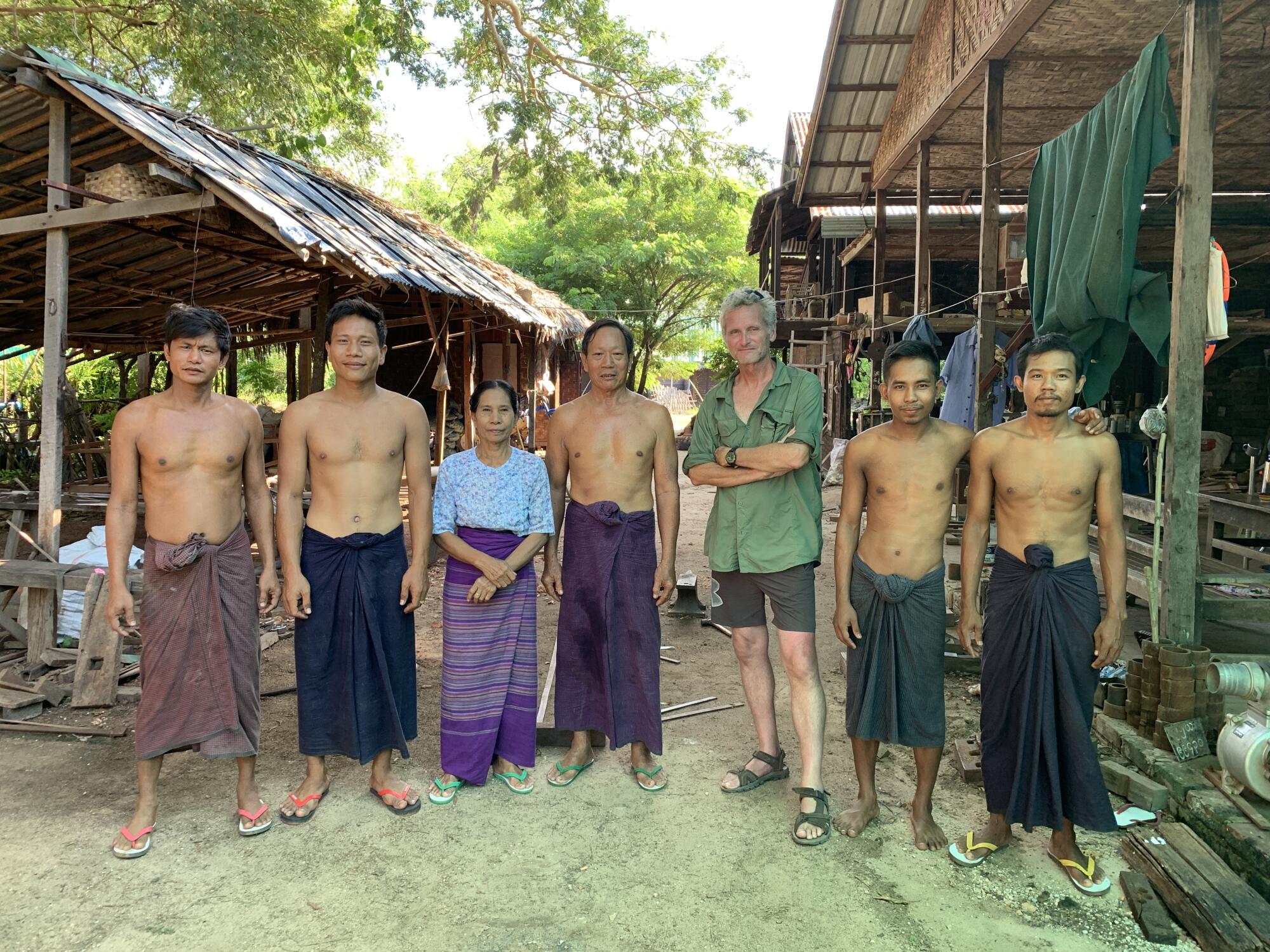 Paul Salopek with a family of oxcart makers in northern Myanmar. 