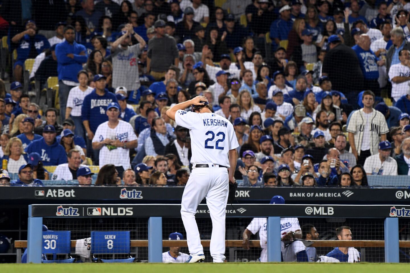 Clayton Kershaw walks back to the dugout after giving up back-to-back home runs in the eighth inning against the Nationals.