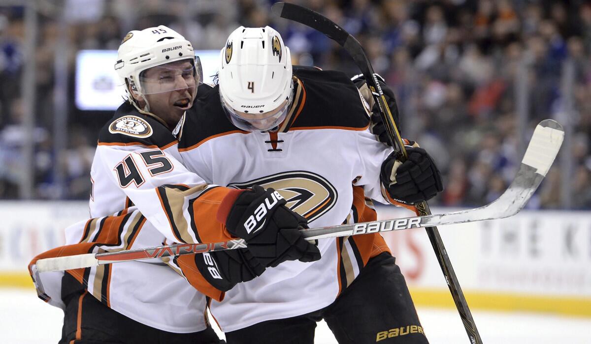 The Ducks' Cam Fowler, right, celebrates his power-play goal with teammate Sami Vatanen during the third period of Monday's game against the Toronto Maple Leafs. Anaheim's 3-2 win against Toronto was followed by a 5-1 loss to Montreal.