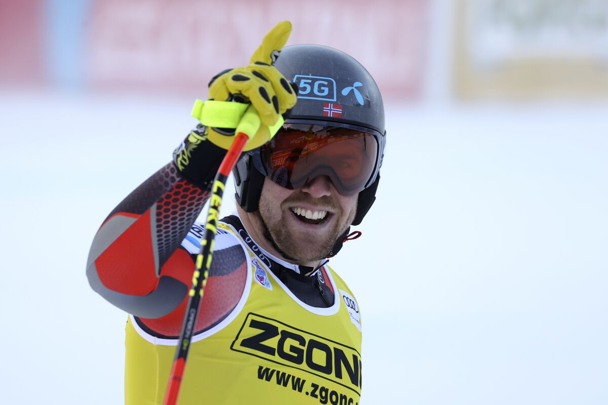 Norway's Aleksander Aamodt Kilde celebrates in the finish area after completing an alpine ski, men's World Cup super G, in Val Gardena, Italy, Friday, Dec. 17, 2021. (AP Photo/Alessandro Trovati)